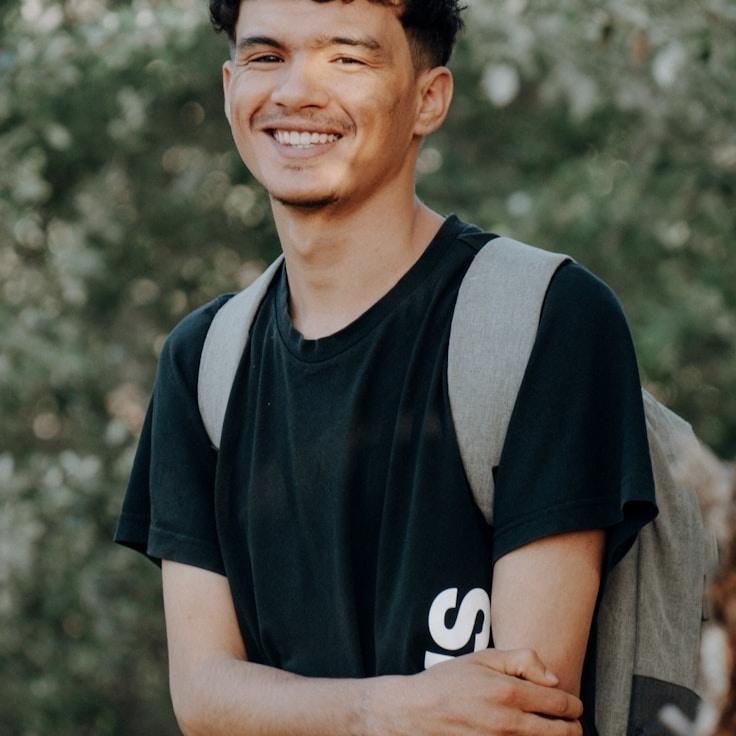 Aditi Rao, Lead Design Curator at OakFieldHarbor, reviewing corporate floral arrangements